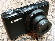 My broken Canon S95, with the lens which is stuck open...  RIP old friend